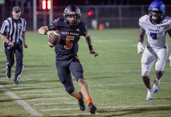 Lake Wales quarterback Brycen Levidiotis runs for a first down against Sebring, but the play was called back because of a penalty.
