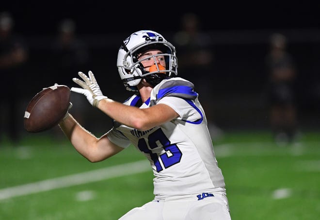 After taking a handoff, Lakeland Christian's Preston Garcia (#13) looks for a wide open wide receiver Ian Goines. The trick play resulted in a big gain for the Vikings in the first quarter. The Cardinal Mooney Cougars hosted the Lakeland Christian Vikings in a regional semi-final game Friday, Nov. 17, 2023 in Sarasota.