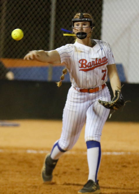 Bartow Yellow Jackets pitcher Katelynn Oxley (7) throws out a runner at first in the Class 6A, District 10 championship game against George Jenkins on Thursday night in Bartow. Bartow won the game 5-1.