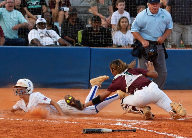 Eagles catcher Olivia Newman is late on the tag as Bartow's Alyssa Hillman (8) scores on a teammate's double.