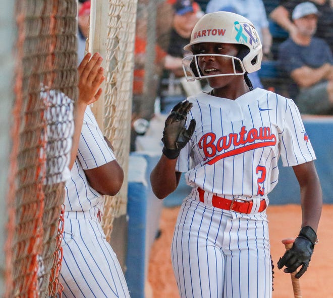 Bartow's Shayla Narcisse (2) is congratulated by teammates after scoring on a bases-loaded walk.