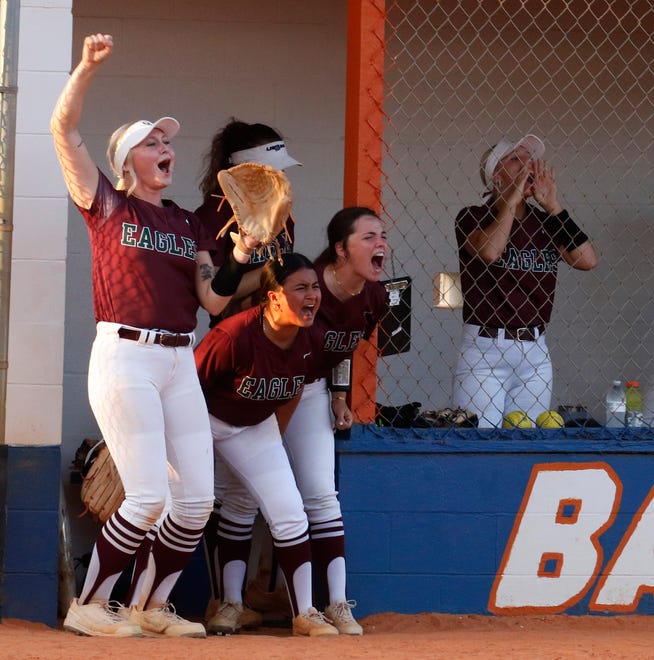 The George Jenkins bench celebrates after scoring the first run of the game Thursday in Bartow.