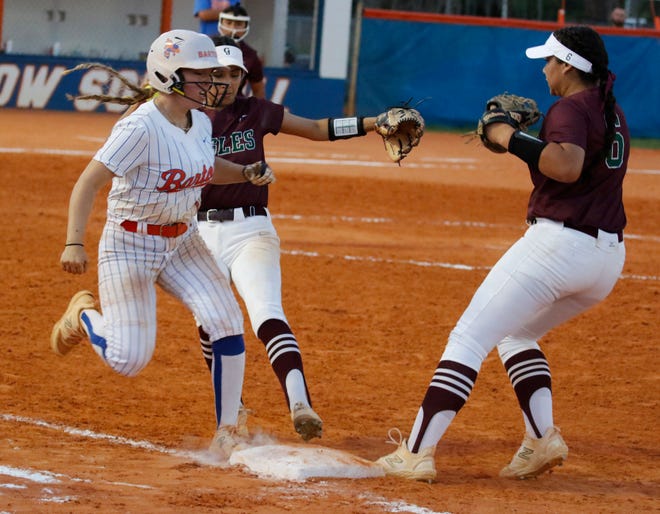 Bartow’s Kyndal Cornelius (1) is safe at first after beating Jenkins' first baseman Elis Correa (16) to the bag as second baseman Kamryn Wallisa races to cover.