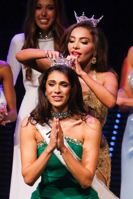 Miss Florida 2023 Juliette Valle pins the crown in place on the new the 2024 Miss Florida, Casana Fink at the 2024 Miss Florida Pageant Finals at the RP Funding Center in Lakeland on Saturday June 29, 2024. Fink will use her platform as Miss Florida to educate and advocate for organ and tissue donation through her foundation Give to Live.