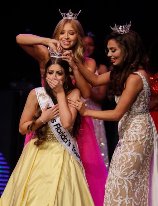2023 Miss Florida’s Teen Anna-Katherine Risalvato places the crown on the head of Miss St. Augustine’s Teen Ireland Harkins as 2023 Miss Florida Juliette Valle assists at the RP Funding Center in Lakeland on Saturday, June 29, 2024.