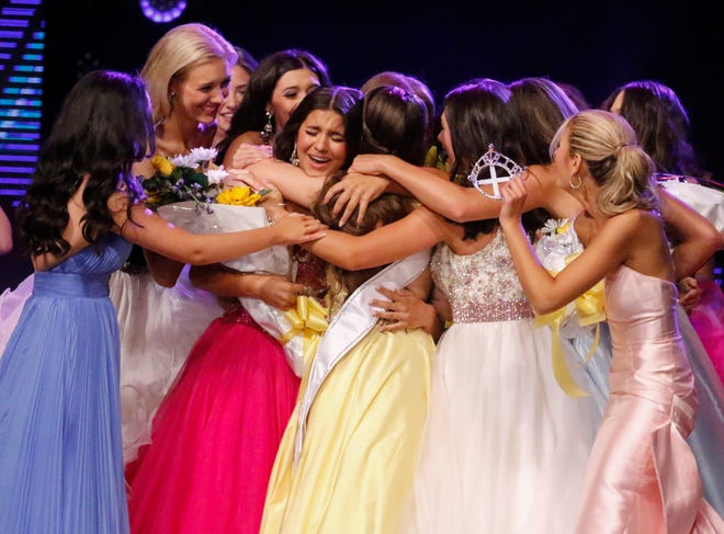 Ireland Harkins, the 2024 Miss Florida's Teen, is mobbed by her fellow contestants after winning the title at the RP Funding Center in Lakeland on Saturday, June 29, 2024.