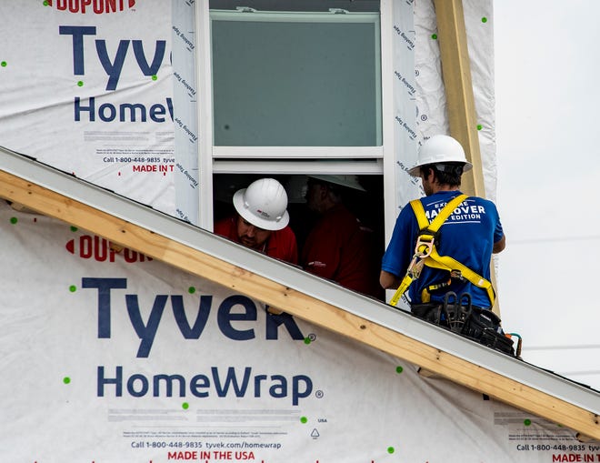 Construction crews work on 2 homes for the Extreme Makeover Home Edition program on Slippery Rock Street in Auburndale Fl. Wednesday August 7 2024.