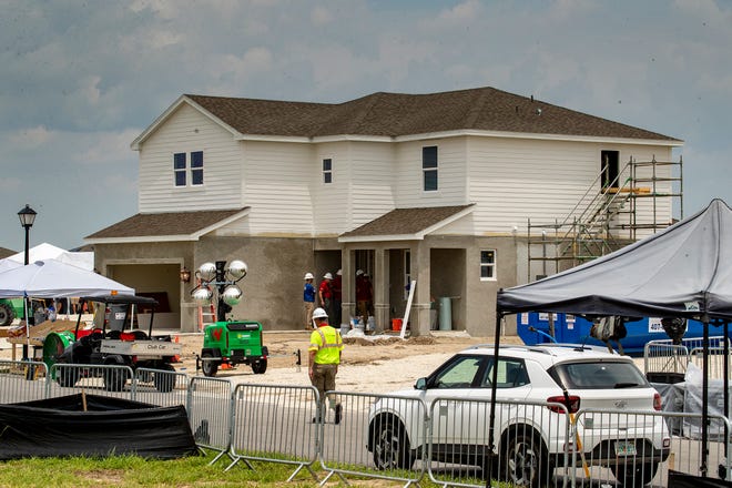 Construction crews work on 2 homes for the Extreme Makeover Home Edition program on Slippery Rock Street in Auburndale Fl. Wednesday August 7 2024.