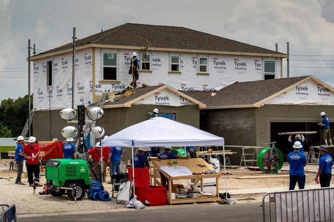 Construction crews work on 2 homes for the Extreme Makeover Home Edition program on Slippery Rock Street in Auburndale Fl. Wednesday August 7 2024.