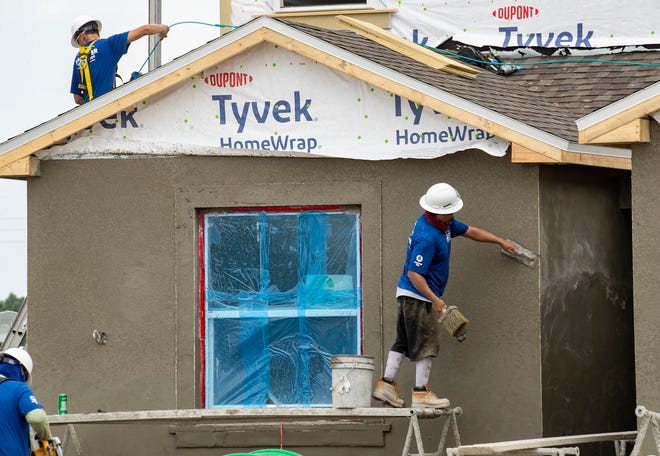 Construction crews work on 2 homes for the Extreme Makeover Home Edition program on Slippery Rock Street in Auburndale Fl. Wednesday August 7 2024.