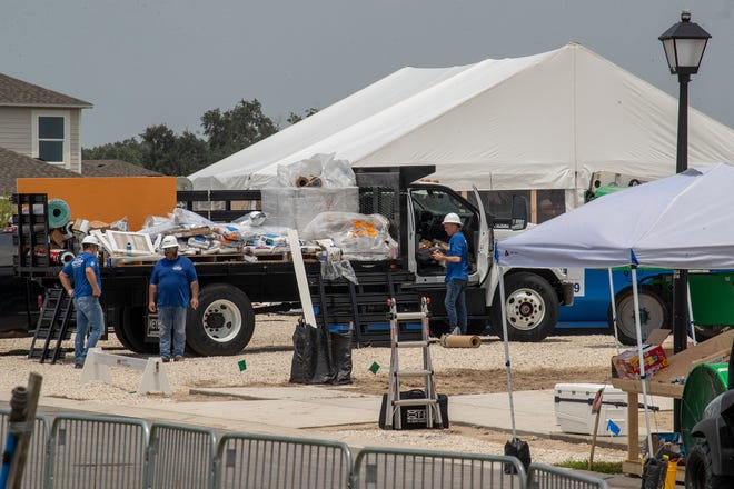 Construction crews work on 2 homes for the Extreme Makeover Home Edition program on Slippery Rock Street in Auburndale Fl. Wednesday August 7 2024.