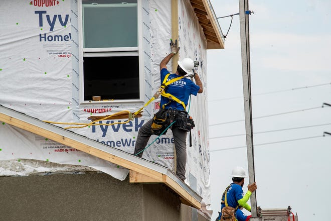 Construction crews work on 2 homes for the Extreme Makeover Home Edition program on Slippery Rock Street in Auburndale Fl. Wednesday August 7 2024.