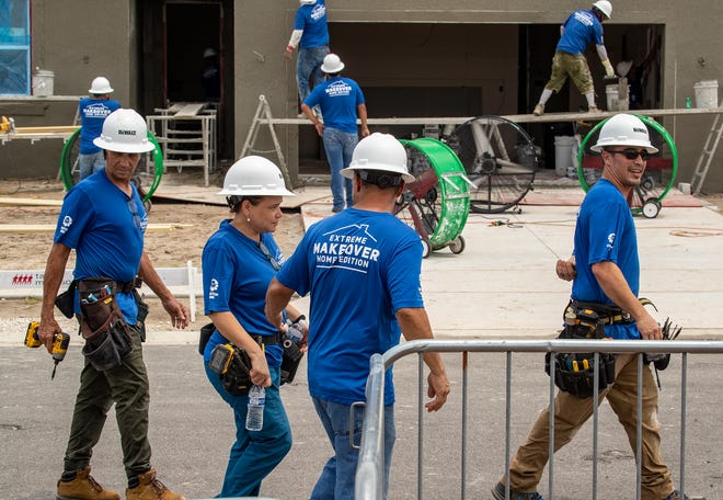 Construction crews work on 2 homes for the Extreme Makeover Home Edition program on Slippery Rock Street in Auburndale Fl. Wednesday August 7 2024.