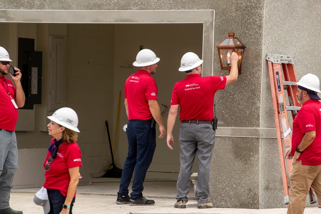 Construction crews work on 2 homes for the Extreme Makeover Home Edition program on Slippery Rock Street in Auburndale Fl. Wednesday August 7 2024.