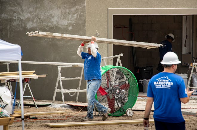 Construction crews work on 2 homes for the Extreme Makeover Home Edition program on Slippery Rock Street in Auburndale Fl. Wednesday August 7 2024.
