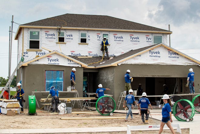 Construction crews work on 2 homes for the Extreme Home Makeover in Auburndale Fl. Wednesday August 7 2024.
