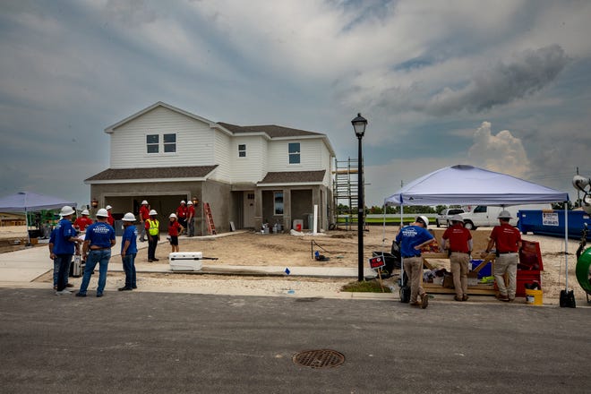 Construction crews work on 2 homes for the Extreme Home Makeover in Auburndale Fl. Wednesday August 7 2024.