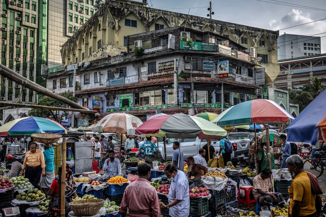 August 14, 2024: Sellers wait for costumers at their stalls at a wholesale market in Dhaka, days after a student-led uprising that ended the 15-year rule of Sheikh Hasina.