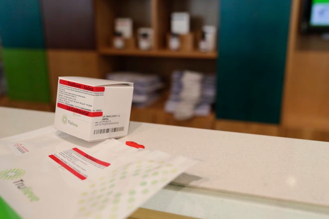 Douglas Dixon purchased an eighth of LA Confidential smokable medical marijuana, the first sold in Florida at Trulieve on Capital Circle near Park Avenue in Tallahassee Thursday, March 21, 2019.